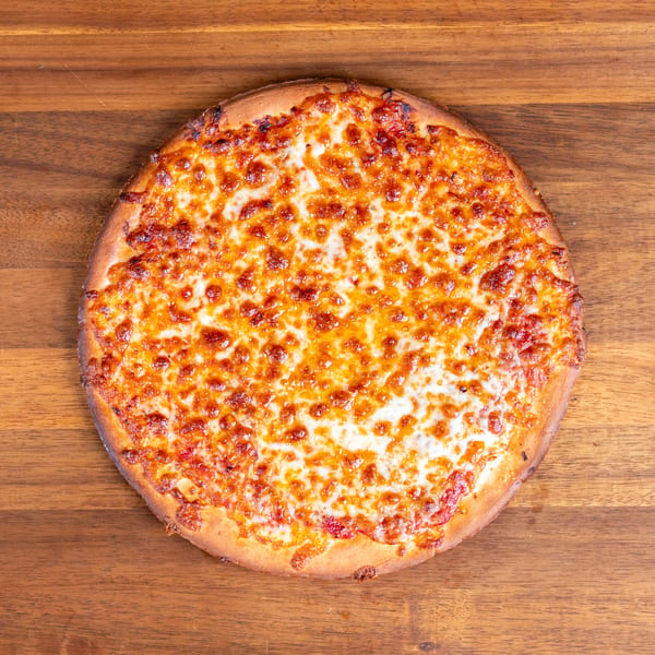 Overhead view of a hot, bubbly cheese pizza on a rustic wooden surface.